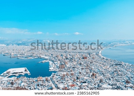 Beautiful landscape and cityscape from Hakodate Mountain with Snow in winter season. landmark and popular for attractions in Hokkaido, Japan.Travel and Vacation concept Royalty-Free Stock Photo #2385162905