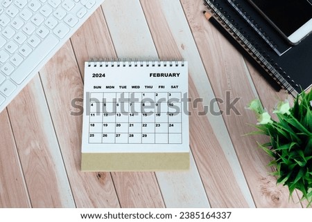 White January 2024 calendar on office wooden desk Royalty-Free Stock Photo #2385164337