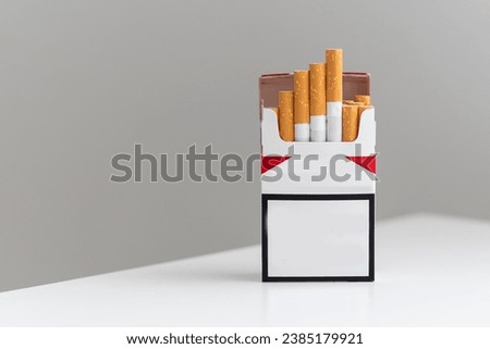 Unbranded cigarette pack with empty background Royalty-Free Stock Photo #2385179921