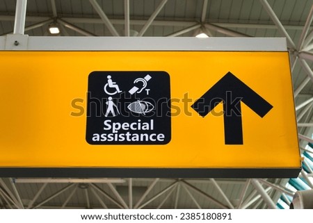 Signboard providing information for those in need of special assistance at the airport.