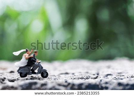 Miniature people : Couple riding the motorcycle , Valentine's Day concept