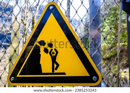 danger sign at a hiking path in germany - on own risk - photo