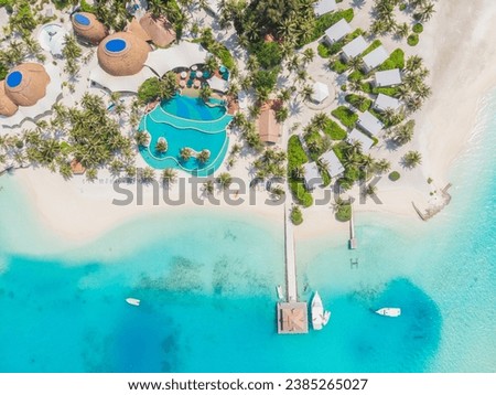 View from a flying drone of the luxury beach against the background of the beauty of the sea with coral reefs. Aero Photography of beautiful paradise tropical beach on island. Top View. Royalty-Free Stock Photo #2385265027