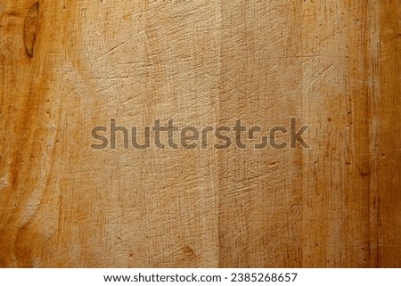 Surface of wooden cutting board, top view. Empty wood board for text, design, presentation, for pictures of dishes in the restaurant. Food advertising for publication, poster. High quality photography
