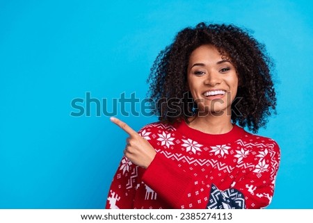 Photo cute lovely lady curly hairstyle raise fingers indicate empty space enjoying winter season discount isolated on blue color background