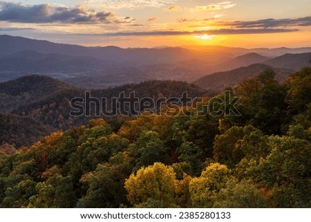 Sunset in The Smoky Mountains off Foothills Parkway. The beautiful Autumn leaves make the trees very colorful. Royalty-Free Stock Photo #2385280133