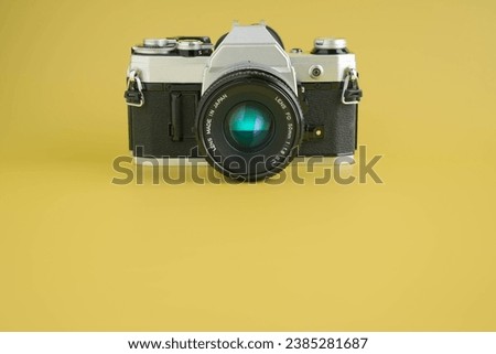 Vintage film photo camera with lens