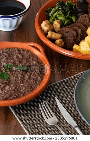The "Papas de Sarrabulho" is a traditional and very popular dish from Minho in the North of Portugal. Royalty-Free Stock Photo #2385296801