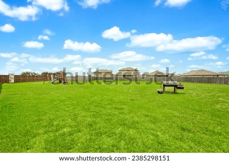 a home back yard with a green lawn 