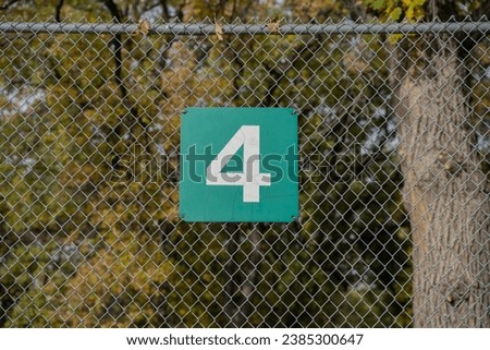 Number signs signage fence Four Three