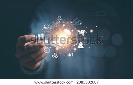 Business global internet connection application technology and digital marketing, Hand holding light bulb with innovation icon network connection, Financial and banking, Digital link tech, Big data. Royalty-Free Stock Photo #2385302007