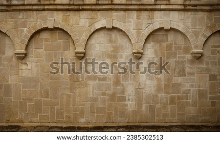 Repeating columns on a block wall in a medieval church in Rouen France