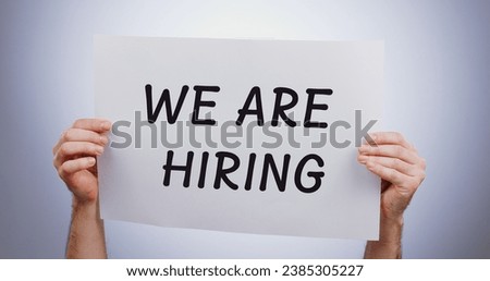 We are hiring sign, hands and recruitment, onboarding and job promotion or advertising isolated on white background. Poster, billboard and communication, work opportunity and offer in a studio Royalty-Free Stock Photo #2385305227