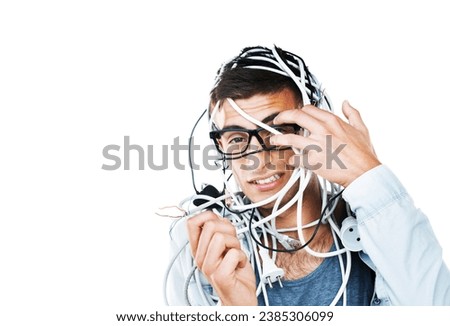 Portrait of man in glasses tangled in cables, wire and isolated on white background. Face of serious geek with cord, wiring and technology of nerd or electrician, mistake and problem on mockup space Royalty-Free Stock Photo #2385306099