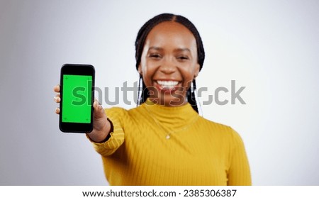 Woman, student and phone green screen for marketing mockup, e learning sign up or news on white background. Portrait of african person on mobile app space, college contact or education FAQ in studio