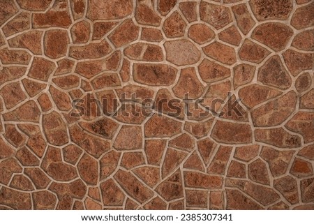 Textured, stone, reddish, background. Actual wall of a building at Hoover Dam.