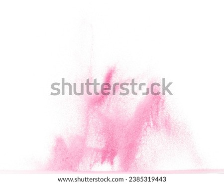 Small size pink Sand flying explosion, sweet sands grain wave explode. Abstract cloud fly. Pink colored sand splash throwing in Air. White background Isolated high speed shutter, throwing freeze stop