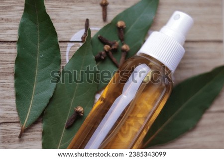 Tincture of laurel and clove spices.  Ethnoscience. Royalty-Free Stock Photo #2385343099