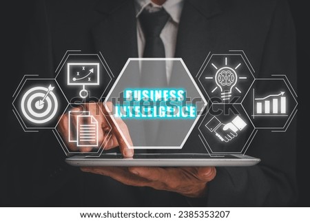 Business intelligence concept, Businessman using digital tablet with business intelligence ion on virtual screen, data analysis, management tools, corporate strategy creation.