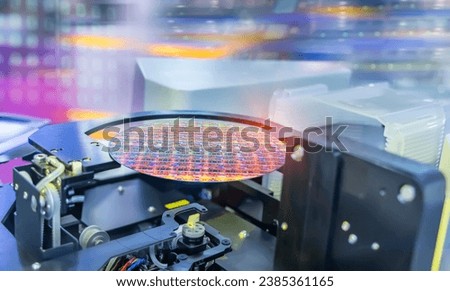 Semiconductor and Computer Chip Manufacturing at Fab or Foundry with robotic arms with silicon wafers  Royalty-Free Stock Photo #2385361165