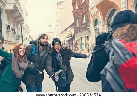 Happy Tourists Enjoying The City And Taking Photo