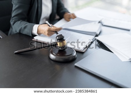 Lawyer businessman working with lawbook in office or courtroom Legal counsel with gavel and legal law. justice and lawyer concept Judge gavel hammer on Lawyer desk