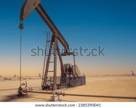 Pump jack in operation in the Arabian desert in the Oman 