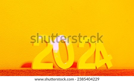 White wooden letters that indicate the nature of the festival to welcome the happy new year 2024.