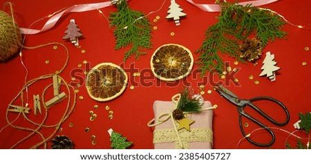Christmas frame with a Christmas tree and gifts on a green background. Winter holidays. Happy New Year. Space for text. Top view, flat lay. Christmas. Template, layout. A greeting card.