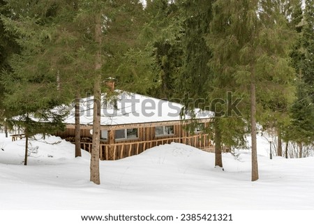 forester's house in the winter forest. High quality photo Royalty-Free Stock Photo #2385421321