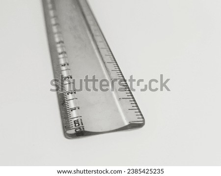 Small transparent scale isolated on a white background - Precision measurement tool.