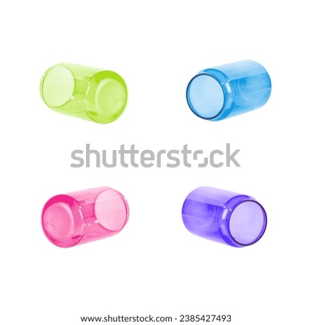 Colored glass jars. Can glasses of different sizes to store objects. Used to preserve the food, concoctions, pickled vegetables, mushrooms. Kitchen utensil for healthy food. Jars isolated on white Royalty-Free Stock Photo #2385427493