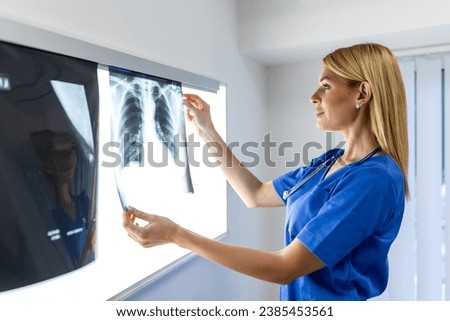 radiology and medicine concept. doctor explaining the results of scan lung on screen to senior patient.