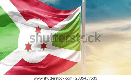 Burundi national flag waving in beautiful sky. The flag waving with dynamic angle.