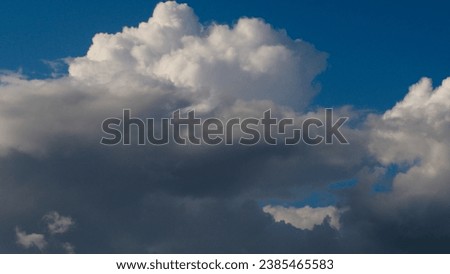 Cumulus and cumulonimbus clouds, during stormy weather