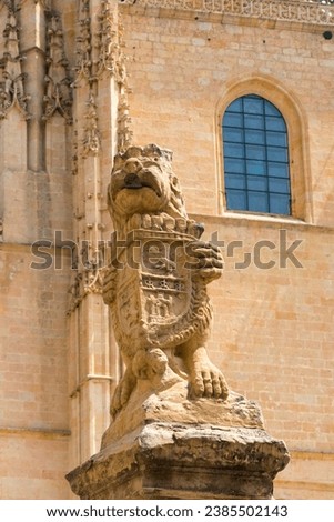  Lion with coat of arms of Castile and Leon in front of the Segovia Cathedral. Royalty-Free Stock Photo #2385502143