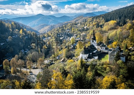 Spania Dolina village, Slovak republic. Religious architecture. Autumn natural scenery. Royalty-Free Stock Photo #2385519559