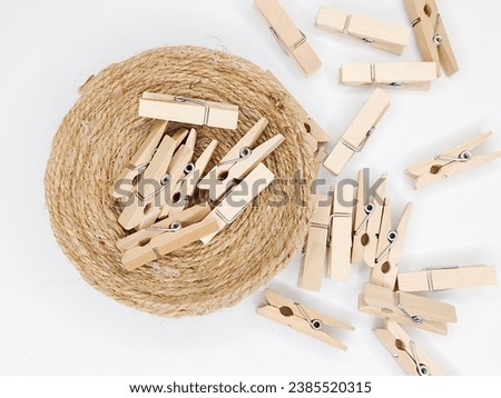 wooden clothespin - Photo of wooden clothespin on hemp rope - hemp rope bowl - hemp rope - wooden clothespin Royalty-Free Stock Photo #2385520315