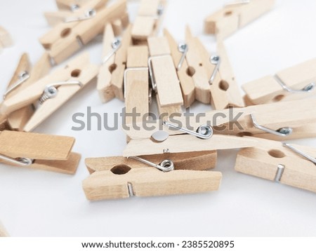 wooden clothespins scattered around - photos of wooden clothespins - wooden clothespins Royalty-Free Stock Photo #2385520895