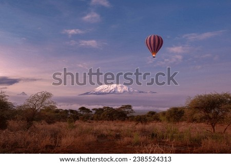 Amboseli National Park with view on snow summit of Kilimanjaro in Kenya. Safari Hot air ballon experience in early morning