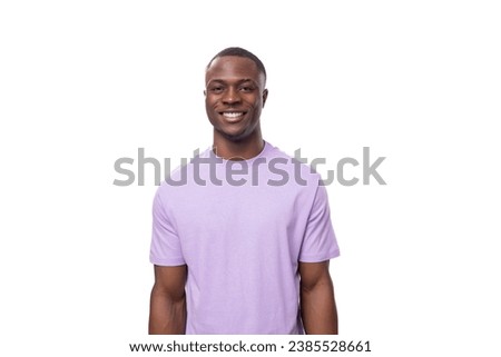 young charismatic american man dressed in a cotton t-shirt on a white background with copy space Royalty-Free Stock Photo #2385528661