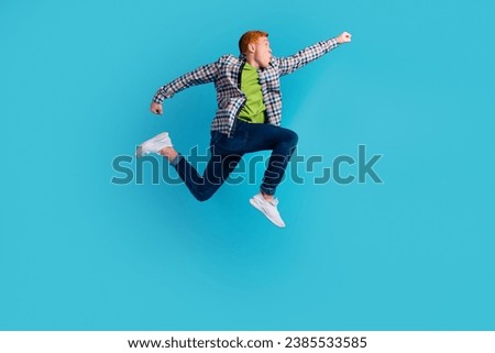 Full length profile photo of cheerful man run look empty space isolated on turquoise color background.