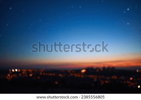 Out of focus image of crescent young Moon and planets on colorful sky. Royalty-Free Stock Photo #2385556805