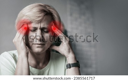 Close up photo of middle aged mature woman suffering from headache on couch at home. Hormonal disorders. Anxiety, stress, depression, burnout, mental health, healthcare,exhausted, tired female Royalty-Free Stock Photo #2385561717