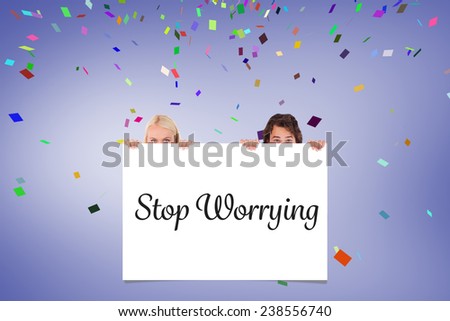 Happy Couple hiding behind a whiteboard against white card