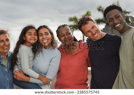 Multiracial people taking a selfie at house rooftop - Multi generational friends having fun together outdoor