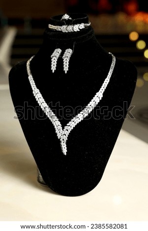 View of beautiful and very expensive diamond jewelery beautifully decorated in a frame made of black velvet cloth