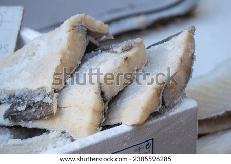 Some pieces of a natural and appetizing salted or salted cod cut into strips