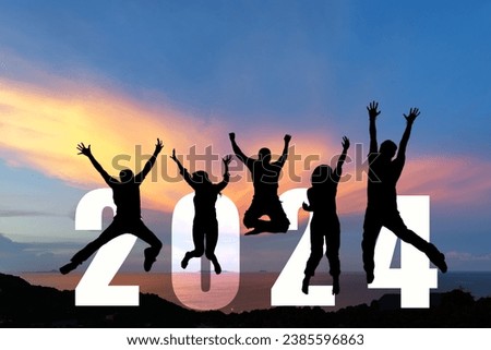 Silhouette happy business teamwork jumping congratulation and celebrate in Happy New year 2024 for change new life future concept. Freedom lifestyle group people team jump part of Number 2024 success Royalty-Free Stock Photo #2385596863