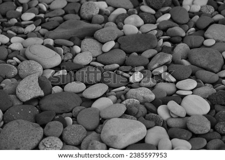 Sea of grey pebbles wallpaper. Gray beach rounded stones background. backdrop of stones on a beach of Black Sea. For banner, postcard, book illustration. 